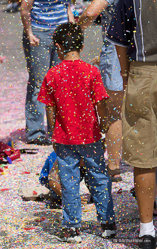 Child gets confetti umpped over his head Child gets confetti umpped over his head